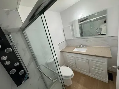 a bathroom with a shower and a toilet and a sink at Private Room Near Airport D34 in Mississauga