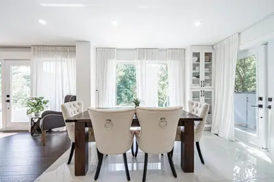 a dining room with a wooden table and chairs at Licensed-8 Acre Estate, Trail & Stream with 3 Beds in Hamilton
