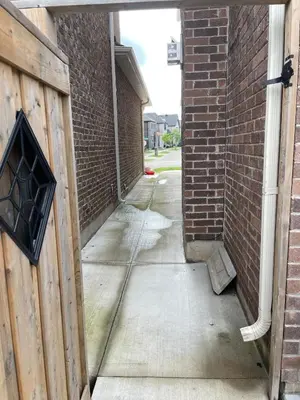 an empty alley with a brick wall and a door at One bedroom and studio Basement Apartment unit sleeps 4 in Oakville