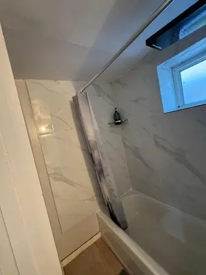 a bathroom with a shower with a shower curtain at Private Room Near Airport D89 in Mississauga