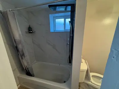 a bathroom with a shower with a glass door at Private Room Near Airport D70 in Mississauga