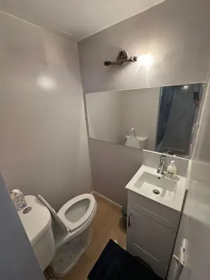 a small bathroom with a toilet and a sink at Private Room Near Airport D70 in Mississauga