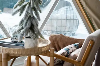 a room with a chair and a table and a window at 'MoonBeam' Boho-Luxe Glamping Dome at Marmora Retreat in Marmora
