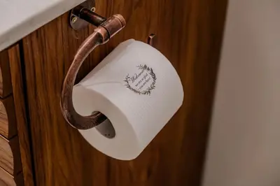 a toilet paper dispenser on a wooden wall at 'MoonBeam' Boho-Luxe Glamping Dome at Marmora Retreat in Marmora