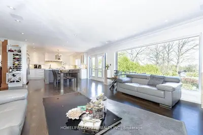 a living room with a couch and a table at Luxury Modern Retreat in Richmond Hill in Richmond Hill