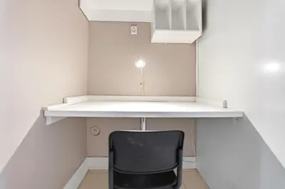 an office with a desk and a black chair at Tranquil Bliss Retreat 9 min to Falls with Free Parking in Niagara Falls