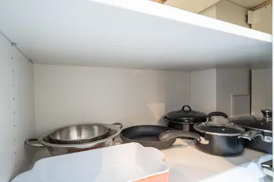 a group of pots and pans in a kitchen at Newly Renovated 2BR Basement Suite, Private Entry in Pickering