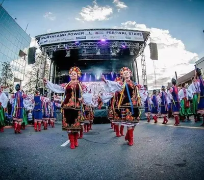 a group of people in costumes walking in front of a stage at 1 Bedroom basement Suite in Junction Bloor West Village in Toronto