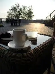 a coffee cup sitting on top of a table at Royal Harbour Resort in Thornbury