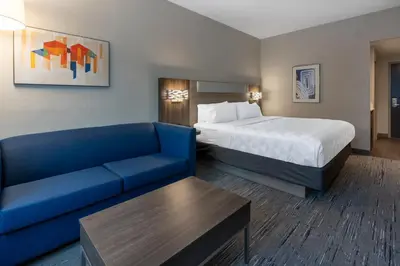 a hotel room with a bed and a couch at Holiday Inn Express & Suites Vaughan-Southwest by IHG in Vaughan