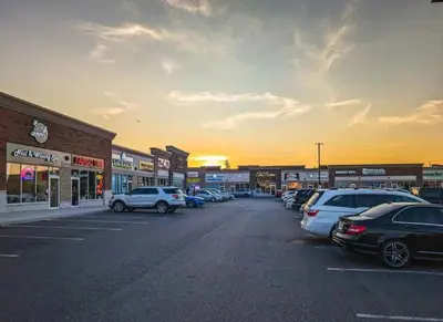 a parking lot with a lot of cars parked at Holiday Inn Express Hotel & Suites Milton by IHG in Milton
