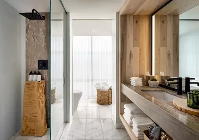 a bathroom with a sink and a bath tub at 1 Hotel Toronto in Toronto