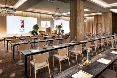 a large room with long tables and chairs at 1 Hotel Toronto in Toronto