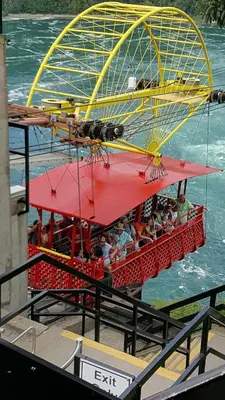 a ferris wheel in the water with people on it at River Rapids Inn in Niagara Falls