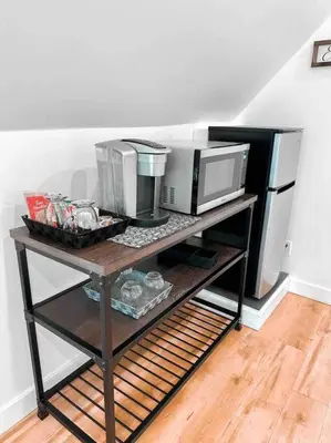 a table with two microwaves on top of it at Etherington Suites in Elora