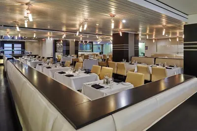 a dining room with white tables and chairs at Hyatt Regency Toronto in Toronto