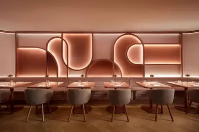 a row of tables and chairs in a restaurant at Revery Toronto Downtown, Curio Collection by Hilton in Toronto