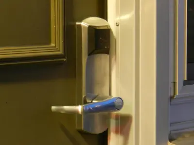 a doorhandle of a door with a dispenser at Capri Inn in St. Catharines