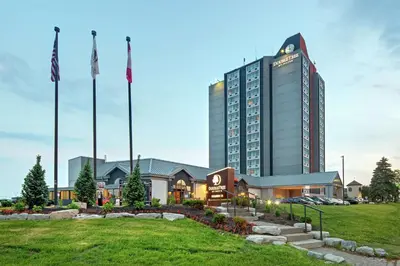 a hotel building with flags in front of it at Doubletree by Hilton Toronto Airport, ON in Toronto