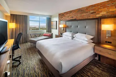 a hotel room with a large bed and a television at Doubletree by Hilton Toronto Airport, ON in Toronto