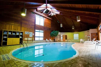 a large swimming pool in a large building at Holiday Inn Niagara Falls-By the Falls by IHG in Niagara Falls