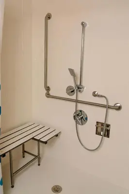 a bench in a bathroom with a shower at TownePlace Suites by Marriott Toronto Northeast/Markham in Markham