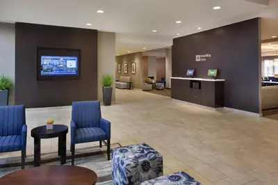 a lobby of a hospital with blue chairs and a desk at TownePlace Suites by Marriott Toronto Northeast/Markham in Markham