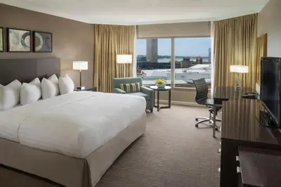 a hotel room with a large bed and a television at InterContinental Toronto Centre by IHG in Toronto