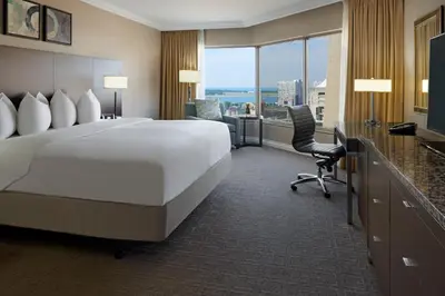 a hotel room with a large bed and a desk at InterContinental Toronto Centre by IHG in Toronto