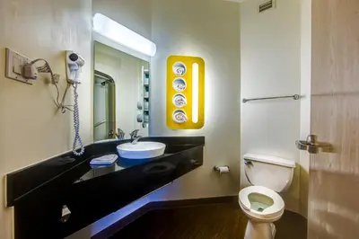 a bathroom with a sink and a toilet at Motel 6-Burlington, ON - Toronto West - Oakville in Burlington