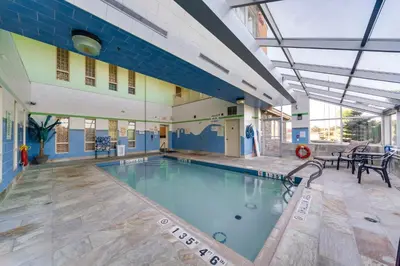 a large swimming pool in a building at Monte Carlo Inn Barrie - Newly Renovated in Barrie