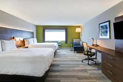 a hotel room with two beds and a desk at Holiday Inn Express Hotel & Suites Toronto - Markham by IHG in Richmond Hill
