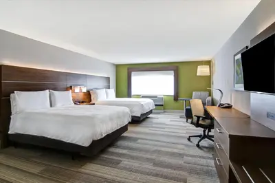 a hotel room with two beds and a flat screen tv at Holiday Inn Express Hotel & Suites Toronto - Markham by IHG in Richmond Hill