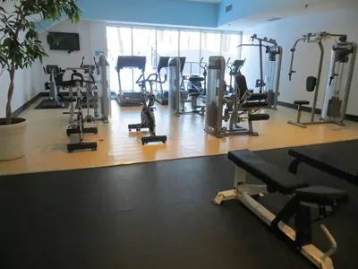 a gym with a bunch of tread machines in it at Toronto Don Valley Hotel and Suites in Toronto
