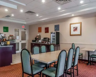 a conference room with a table and chairs at Comfort Inn in Mississauga