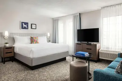a hotel room with a bed and a tv at Sonesta ES Suites Toronto Markham in Markham