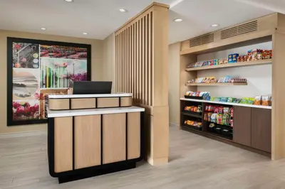 a pharmacyacist with a laptop on top of a counter at Sonesta ES Suites Toronto Markham in Markham
