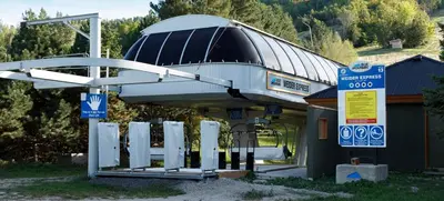 a gas station with a building with a roof at Condo Loft at Blue Mountain in Blue Mountains