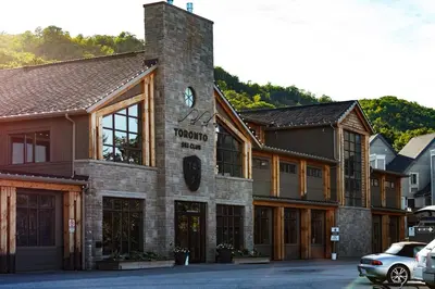 a building with a clock on the front of it at Condo Loft at Blue Mountain in Blue Mountains