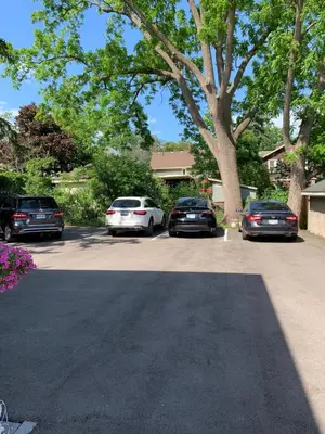 a group of cars parked in a parking lot at Ambiance By The Falls B&B in Niagara Falls