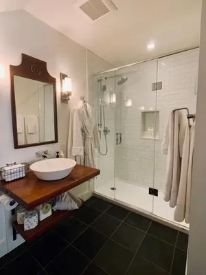 a bathroom with a sink and a shower at Woodbourne Inn in Niagara on the Lake