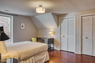 a bedroom with a bed and a desk at The Windsor Hotel by Hoco Hotels Collection in Stratford