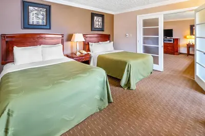 a hotel room with two beds and a television at Rodeway Inn Festival in Stratford