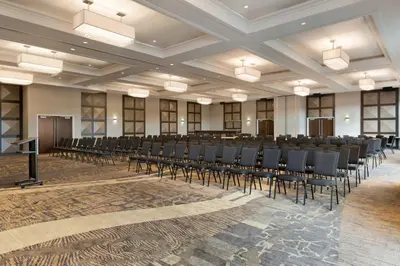 a room with rows of tables and chairs in a room at Courtyard by Marriott Toronto Mississauga/West in Mississauga
