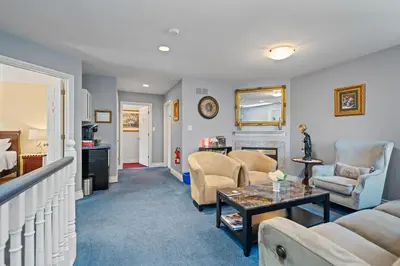 a living room with a couch and a table at Charlottetown House in Niagara on the Lake
