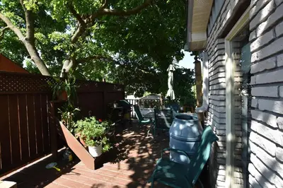 a patio with chairs and plants on a house at 10th Avenue Guest House & Suites in Hanover