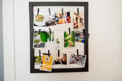 a collage of photos hanging on a wall at Edison's Inn in Stratford