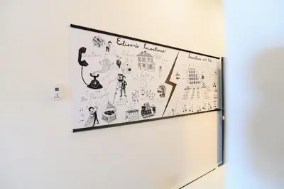 a refrigerator with drawings on the side of it at Edison's Inn in Stratford