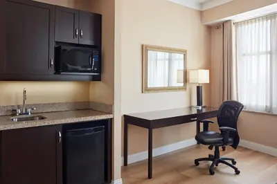 a kitchen with a desk and a chair in a room at Delta Hotels by Marriott Guelph Conference Centre in Guelph