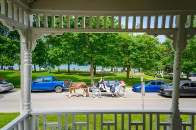 a horse drawn carriage in front of a gazebo at The Old Bank House in Niagara on the Lake